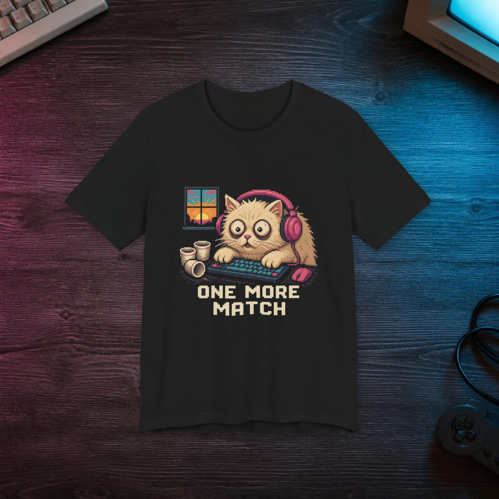 One More Match Gaming Cat T-Shirt — Wear8bit — faithful supplier-product retro gaming room scene; digital mockup [Wear8bit gaming cat v1]