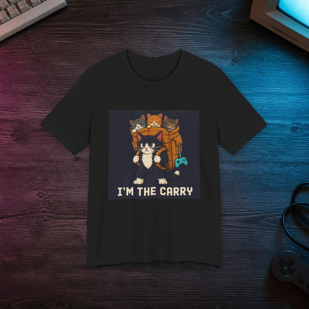 I'M The Carry Gaming Cat T-Shirt — Wear8bit — faithful supplier-product retro gaming room scene; digital mockup [Wear8bit gaming cat v1]
