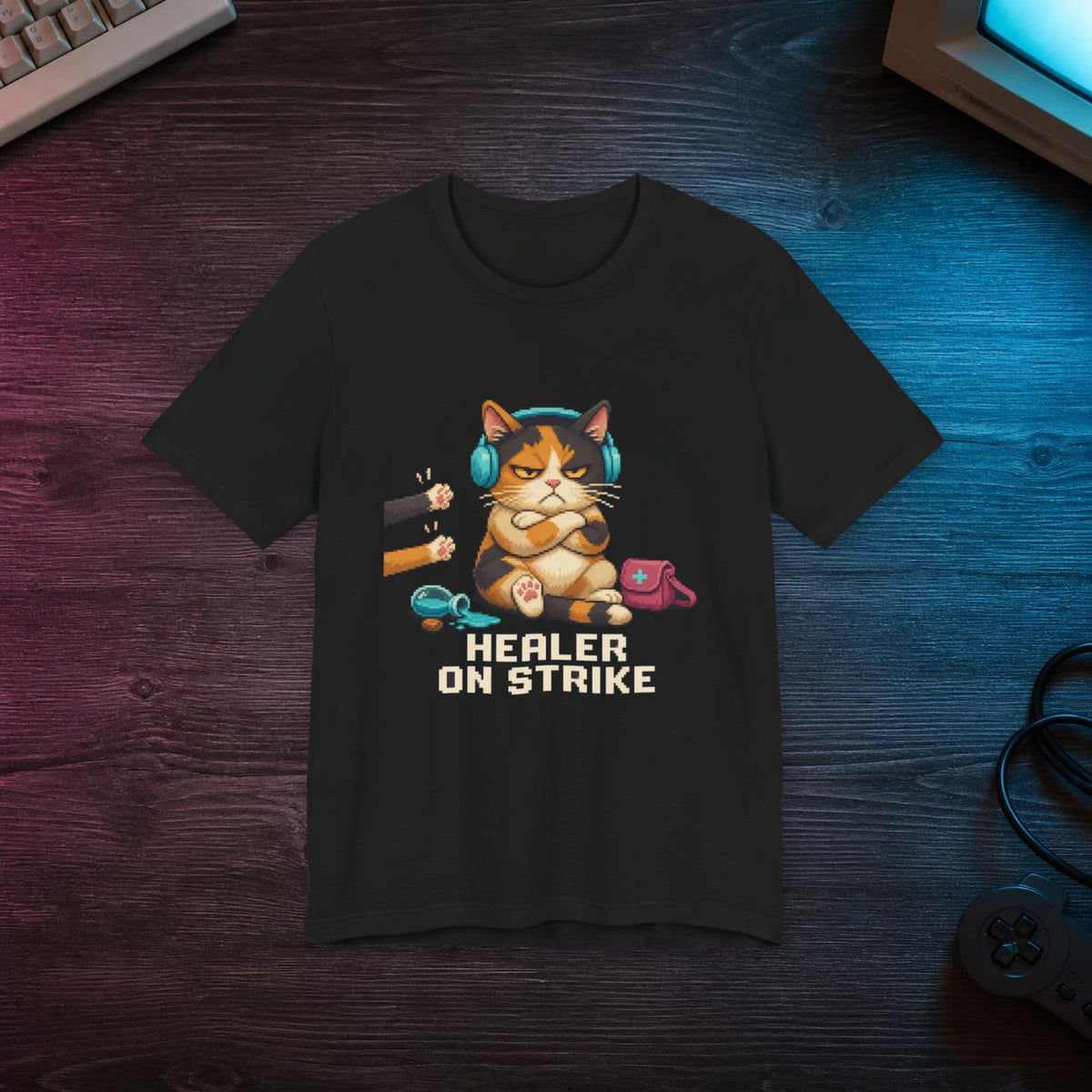 Healer On Strike Gaming Cat T-Shirt — Wear8bit — faithful supplier-product retro gaming room scene; digital mockup [Wear8bit gaming cat v1]